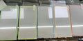 Fluorescent luminous tempered glass screen protector for iPhone on a phone.