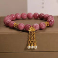 Pink lotus and pink white crystal natural stone bracelet with pearl pendant and lotus tassel in new Chinese style.