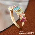 Gold coloured adjustable ring with zircon detail on a white background.