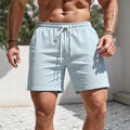Men's loose fit polyester track shorts in straight leg sports style showing colour options