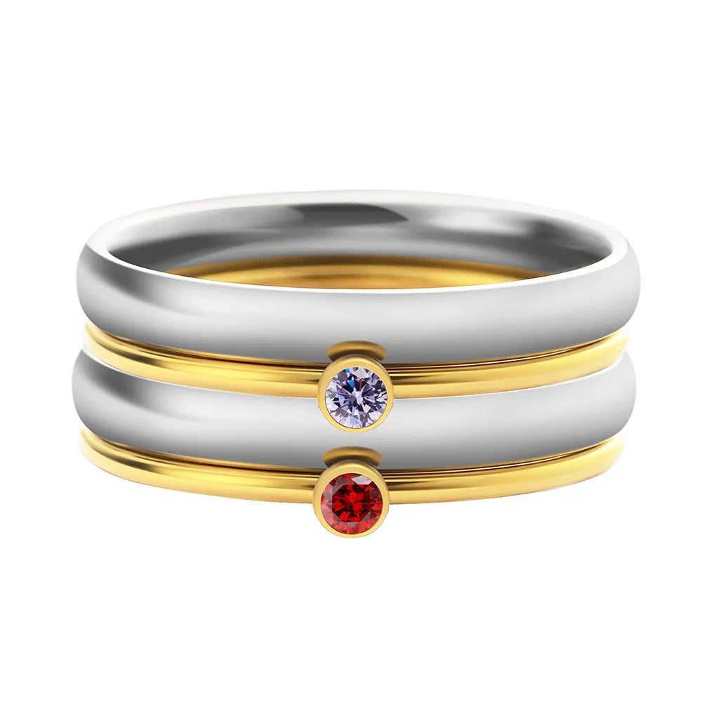 Geometric titanium steel ring with December birthstone colour and engraved superimposed design.