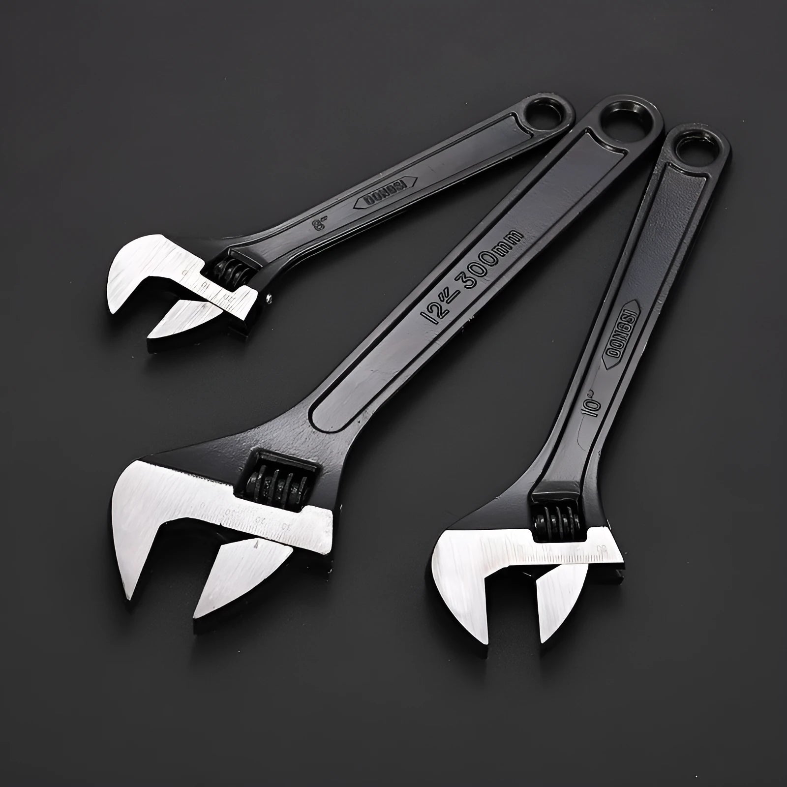 High-carbon steel adjustable spanner with black finish on a grey background.
