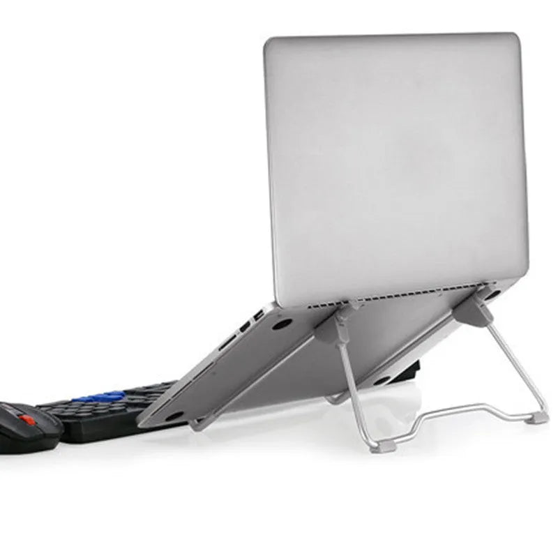 Grey adjustable height laptop and mobile phone stand made from aluminium alloy and plastic on a desk