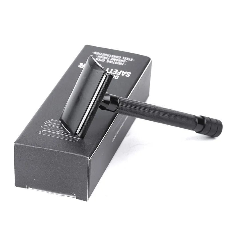Traditional manual shaving kit showing a metal safety razor and a shaving brush on a dark background.