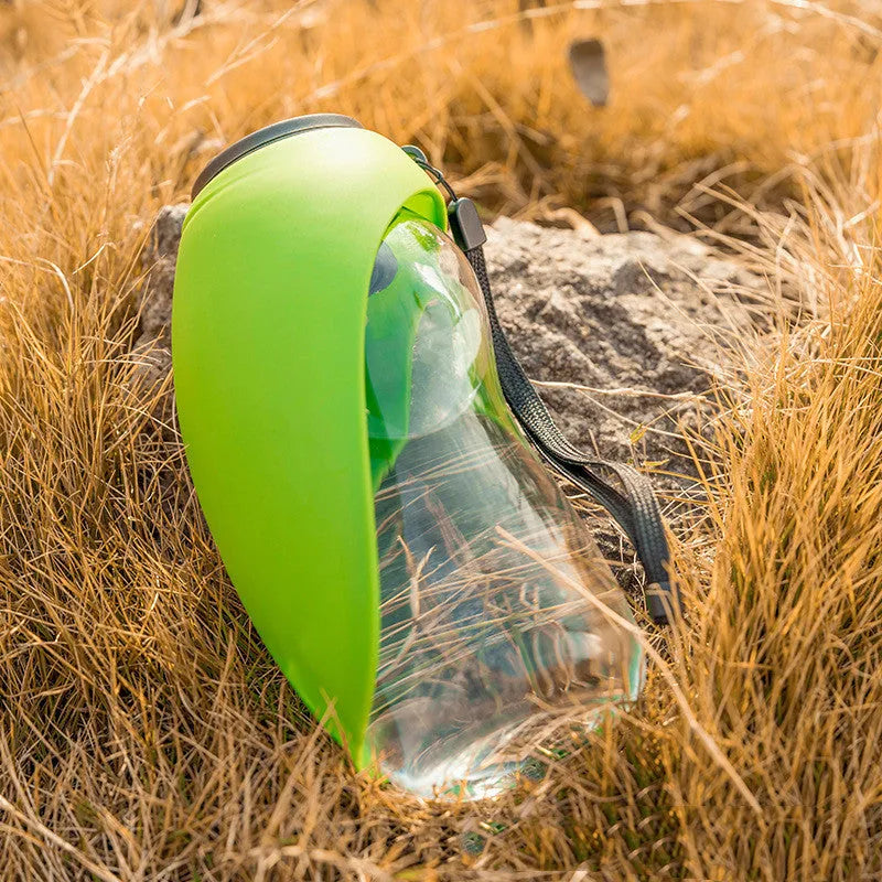 Portable blue pet drinking water bottle with attached bowl and carabiner clip for outdoor use
