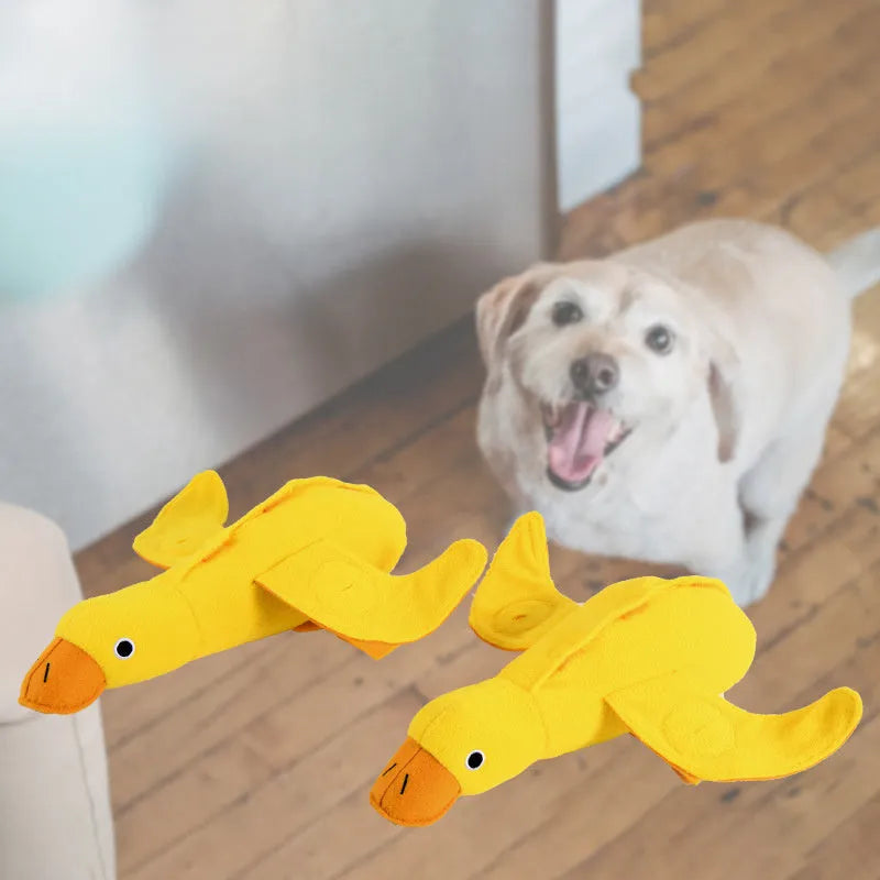 Yellow teddy dog training toy with integrated duck doll and food leak compartments