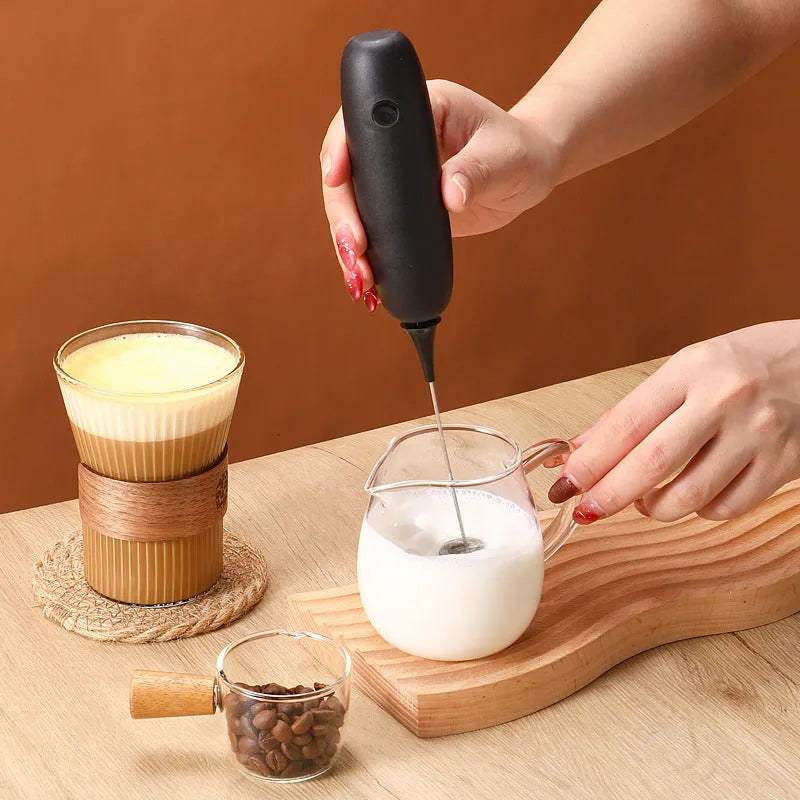Hand-held electric milk frother blender in black and white colour options