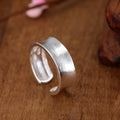 Geometric open ring in frosted sterling silver with adjustable opening