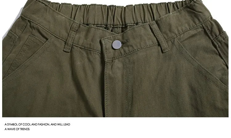 Casual wide-leg cropped workwear pants in apricot colour with elastic mid waist and rivet detailing