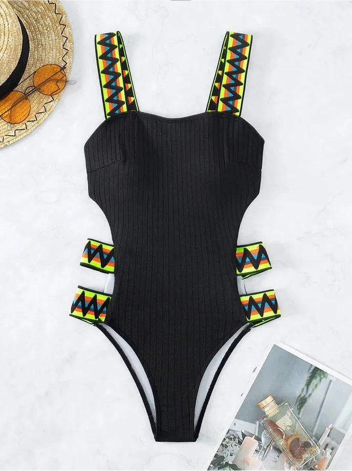 Women's solid colour one-piece bikini swimsuit in black or orange polyester fabric