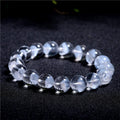 Women's white crystal bracelet with a pyramid charm and Ruyi symbol, showing different bead size options.
