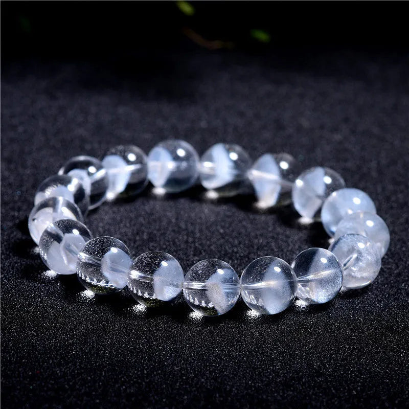 Women's white crystal bracelet with a pyramid charm and Ruyi symbol, showing different bead size options.