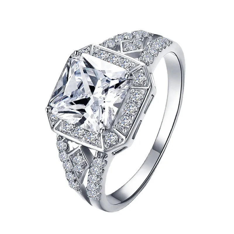 Women's platinum-colour hollow geometric zircon ring on a copper band, shown in size 7.