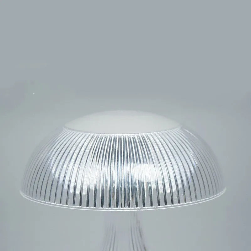 White rechargeable touch night lamp with USB charging cable showing three colour lighting options