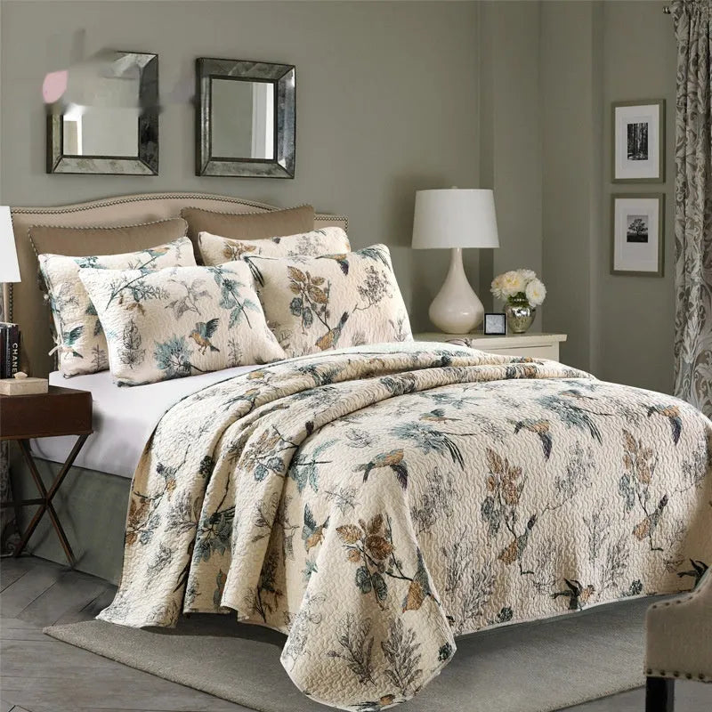Quilted pure cotton bed cover set with two pillowcases in a colourful printed pattern.