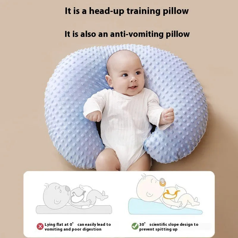 Pink nursing pillow for baby feeding support and spill prevention.