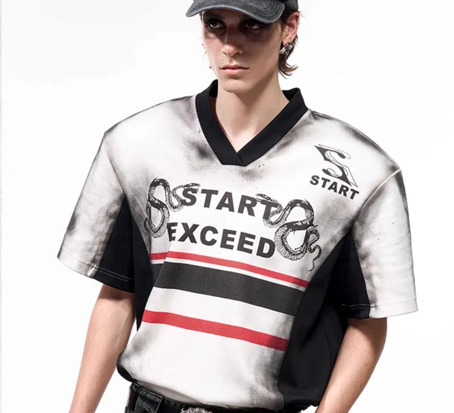 Women's short sleeve V-neck polyester shirt with snake letter print and padded shoulders.