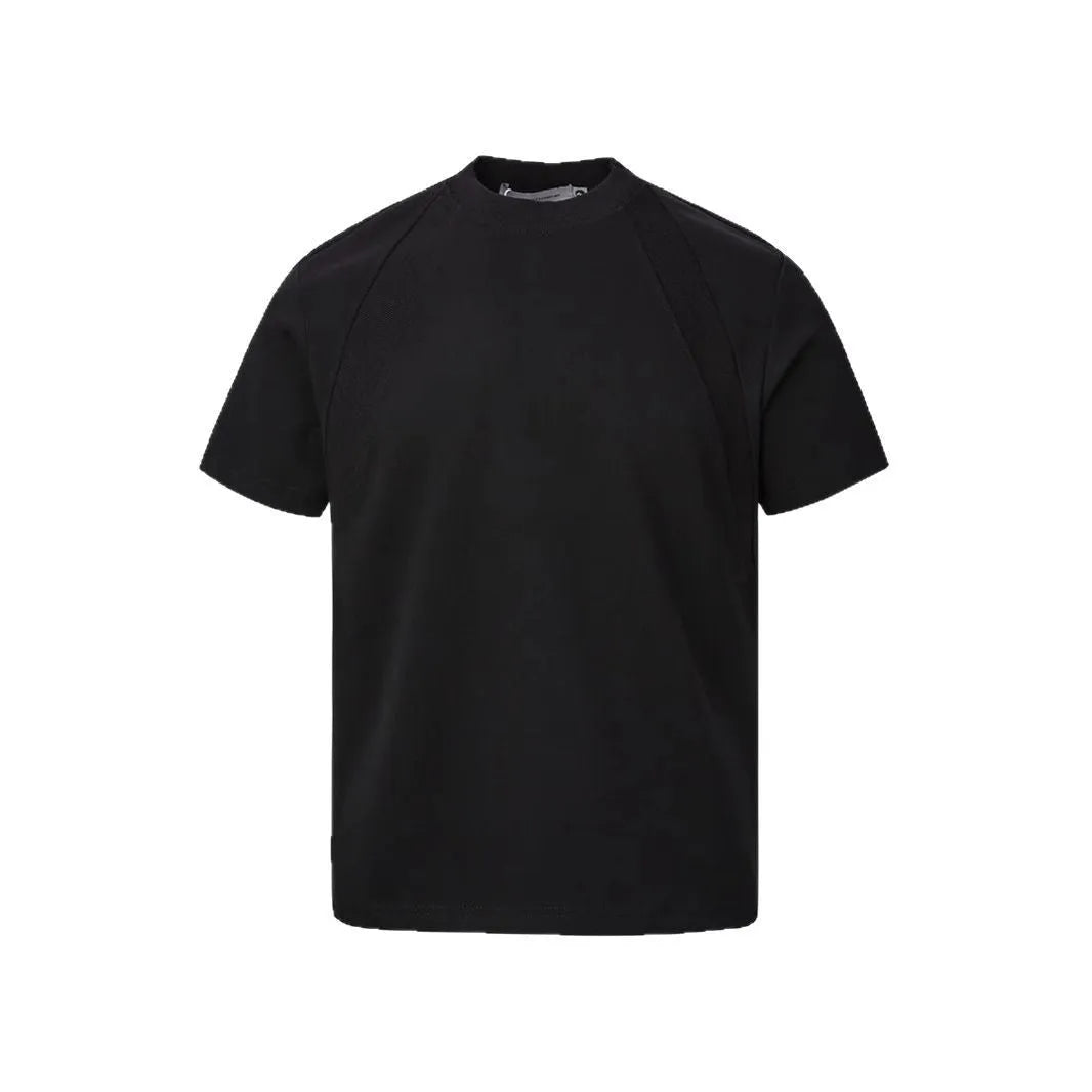 Black loose fit short sleeve top with air layer stitching detail on a hanger