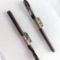 MacBook Pro 15-inch A1286 laptop screen replacement hinge shaft pair on foam packaging.