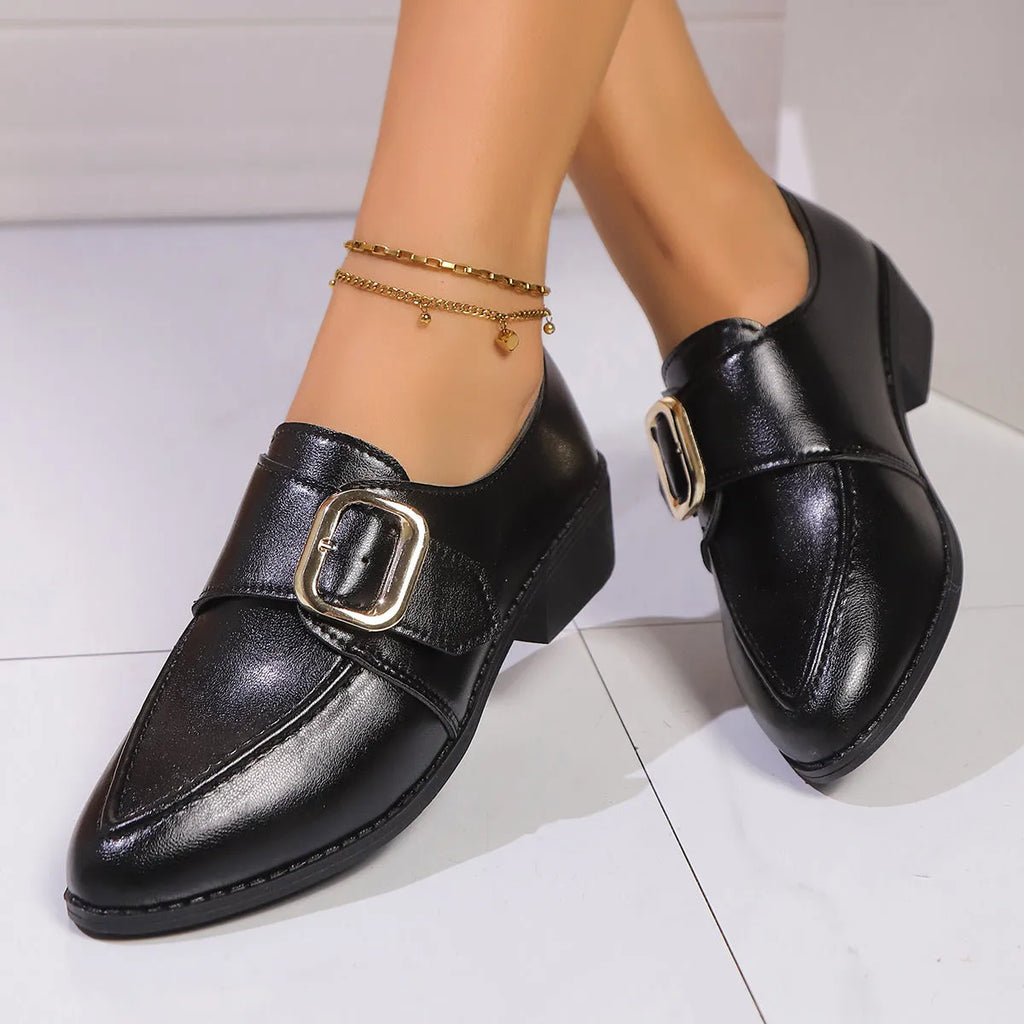Women's brown PU leather slip-on shoe with a large bow on the pointed toe.