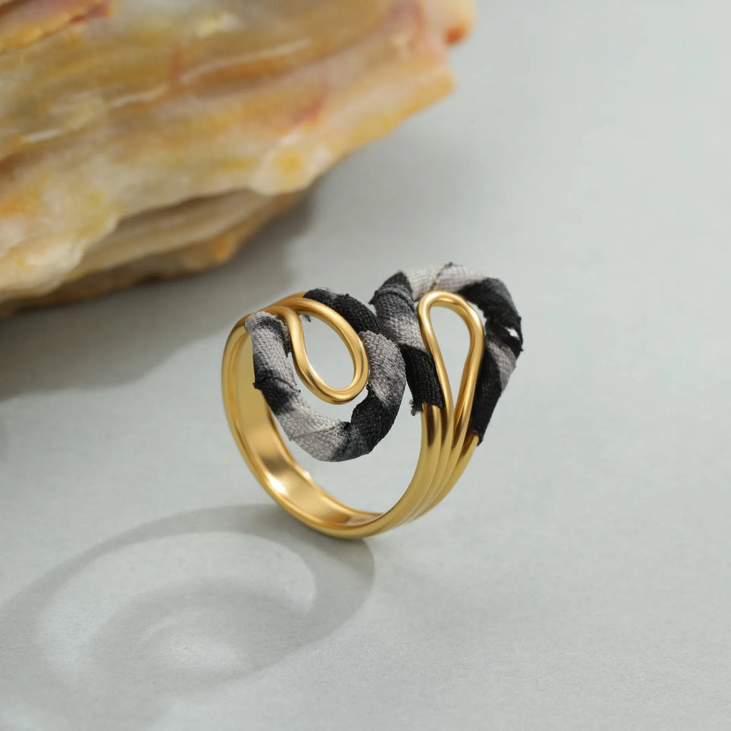 Leopard Series open mouth ring showing geometric asymmetric design with leopard print pattern on stainless steel