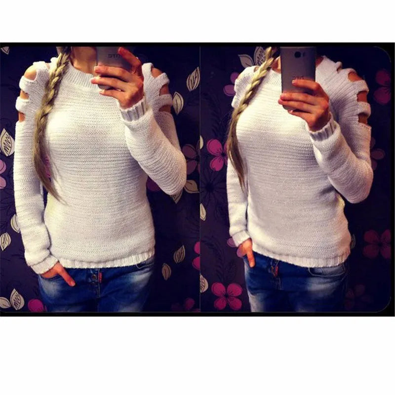 Women's grey rabbit fur hollow-out knitted long sleeve pullover shirt on a hanger.