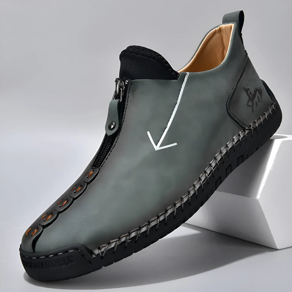 Men's black leather zip-up Martin boots with hand-stitched detail and a round toe.