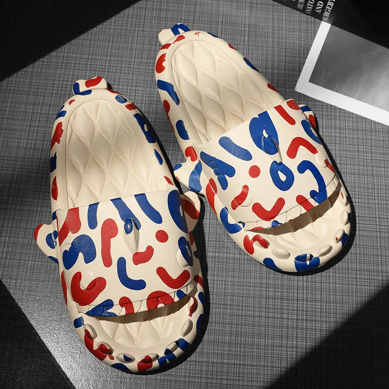 Pair of light beige open-toe EVA slippers with a shark design on a white background.