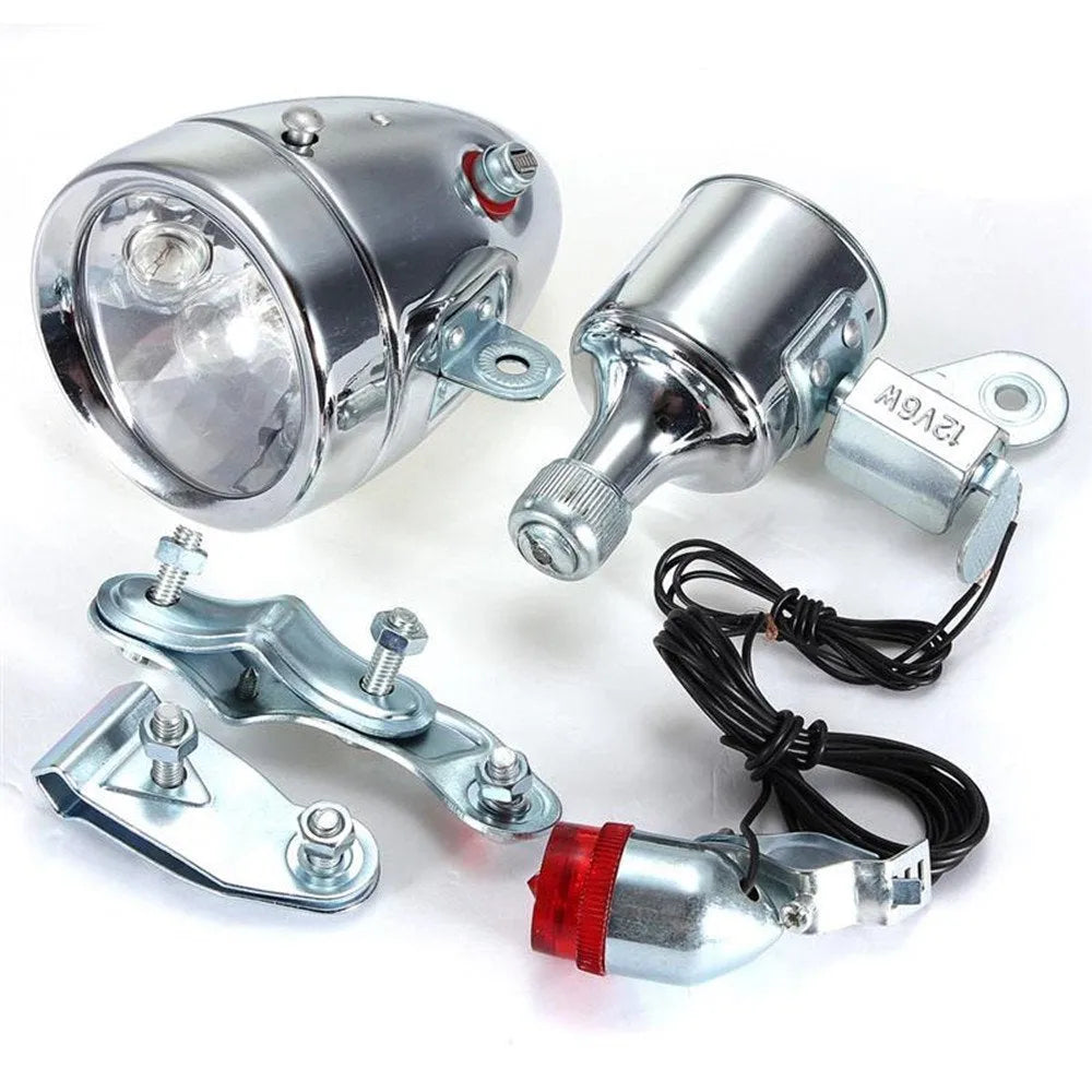 Silver bicycle dynamo generator light mounted on bicycle frame for friction-powered front and rear illumination