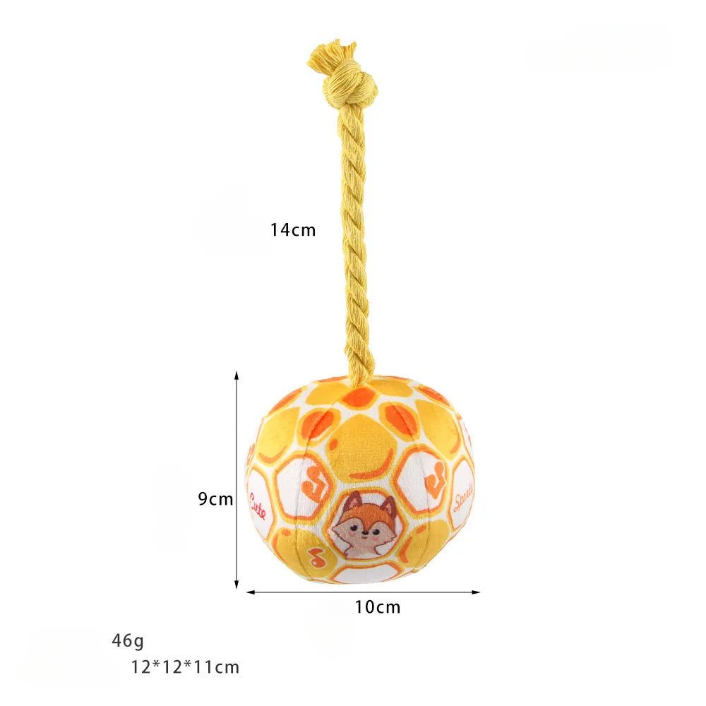 Blue and yellow elastic football dog tug toy with cotton rope construction for chewing and interactive play
