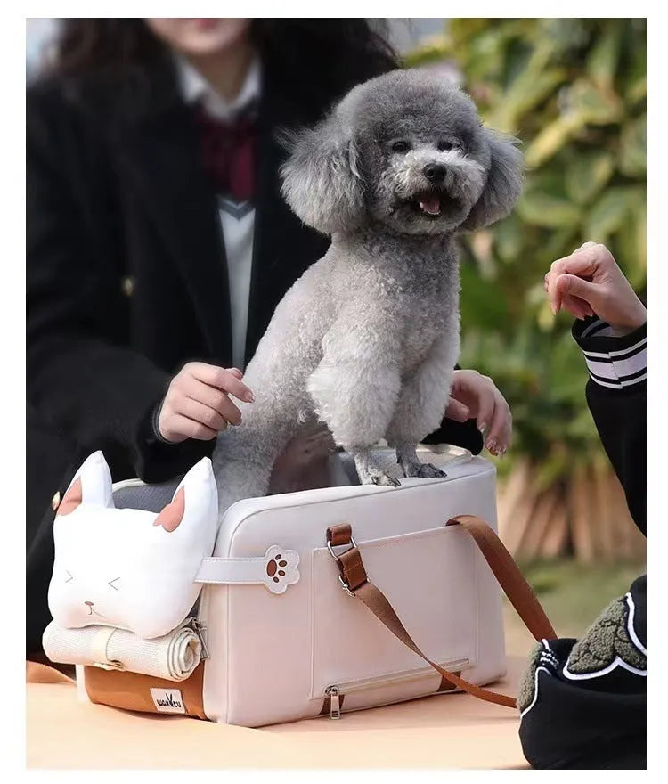 Hard-sided beige pet carrier with shoulder strap for cats and small dogs