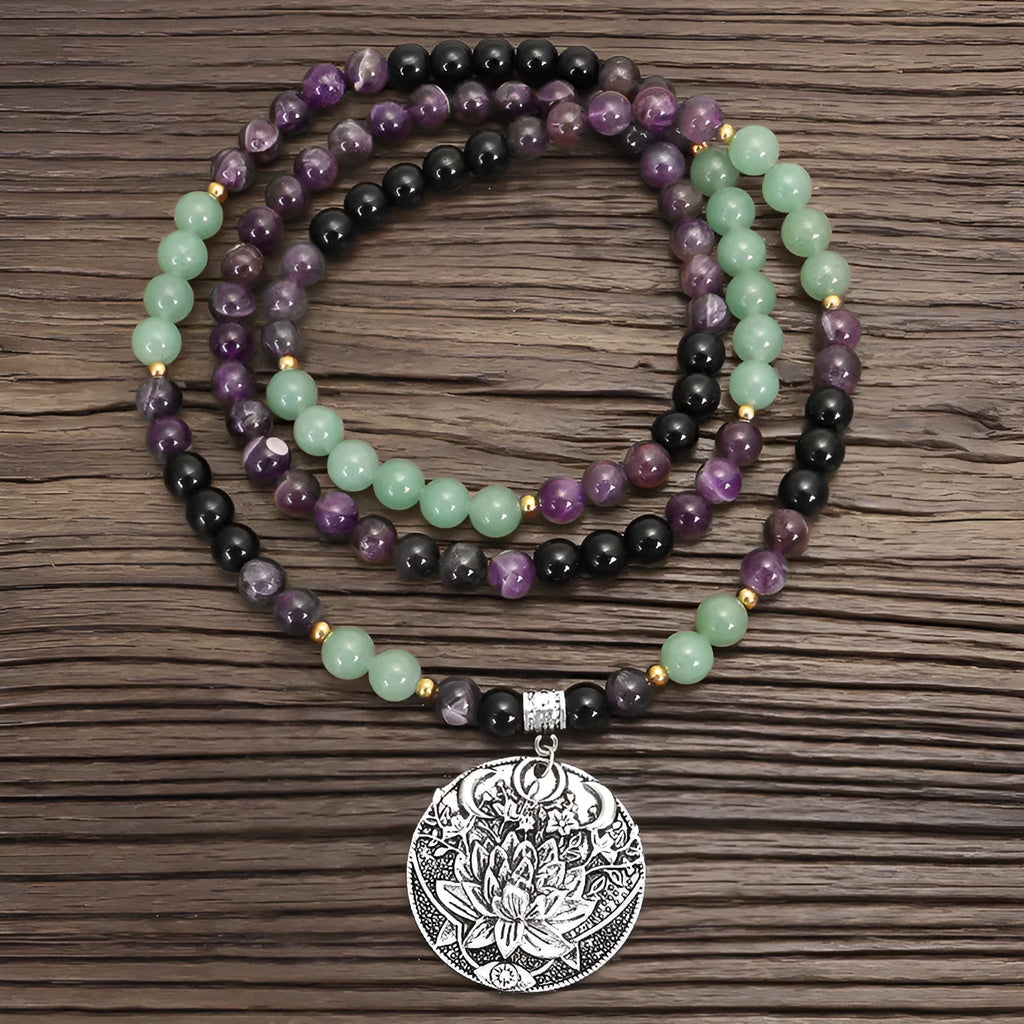 Handmade stone bead necklace with geometric alloy lotus pendant and matching adjustable bracelet.