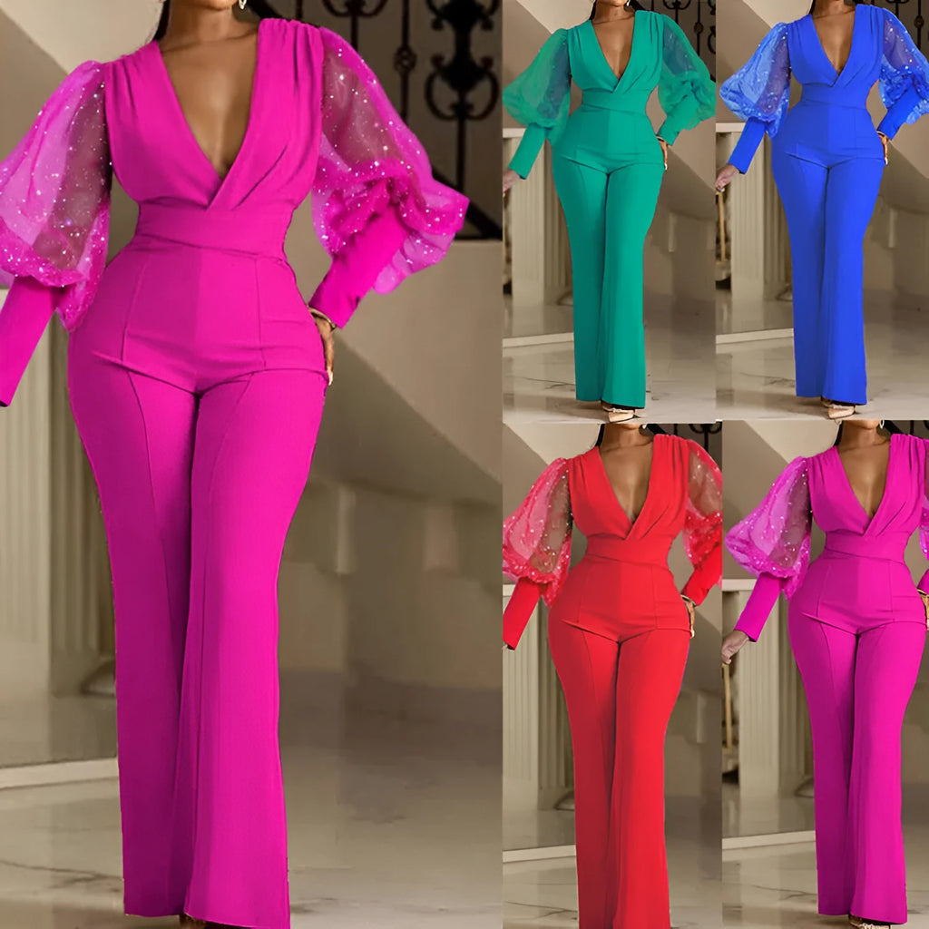 Slim fit wide leg jumpsuit with mesh stitching detail on the sleeves and an elastic waistband.