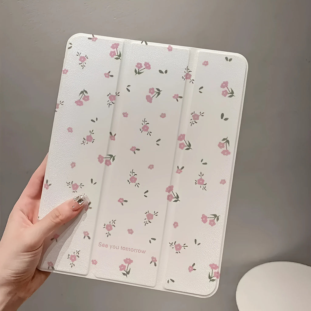 Transparent floral tri-fold iPad case with magnetic stand, showing cartoon print on clear PC hard shell.