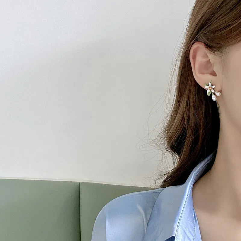 Alloy camellia flower earrings with colour contrast design showing both ear stud and ear clip configurations