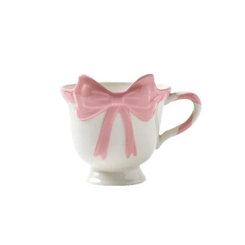 Ceramic mug with heart and bow design in Black Pink colour, showing 301-400ml capacity.