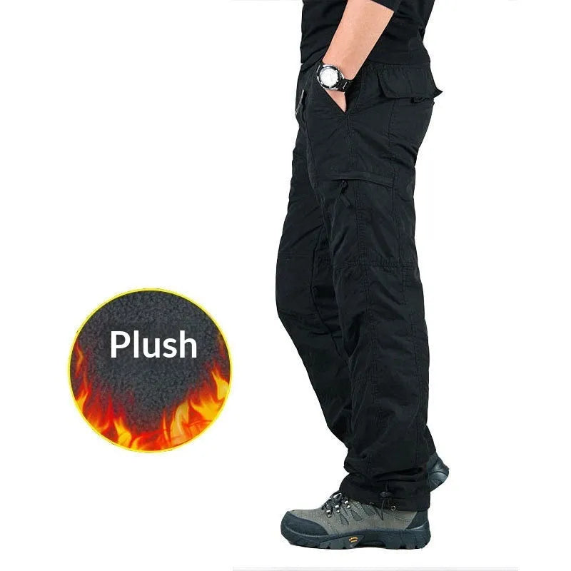 Man wearing thickened warm windproof waterproof fleece lined cotton trousers in army green with belt and double-layer waistband