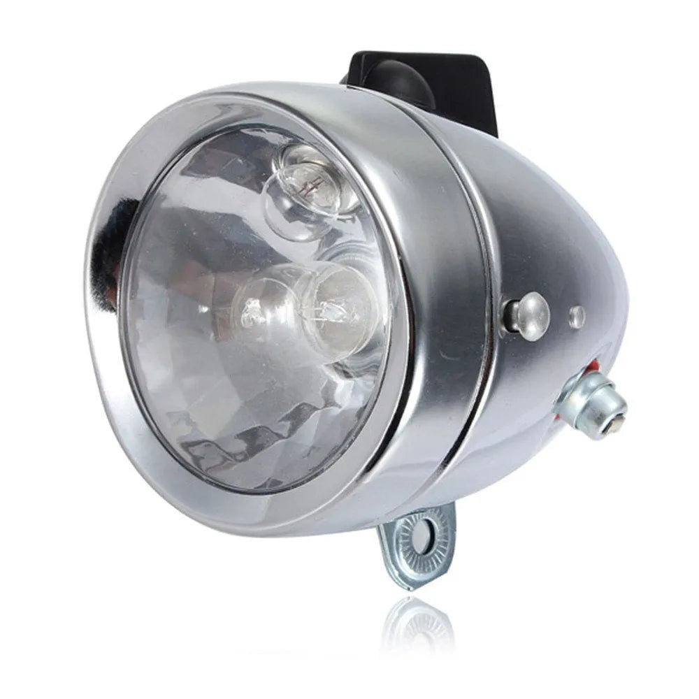 Silver bicycle dynamo generator light mounted on bicycle frame for friction-powered front and rear illumination