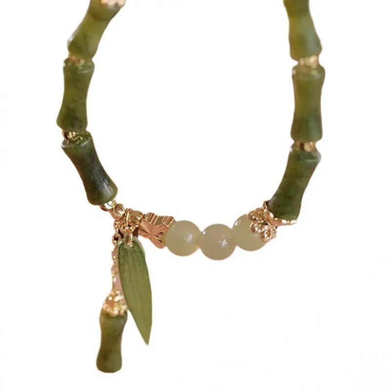A Chinese style glass bead bracelet for women featuring bamboo joint design elements.