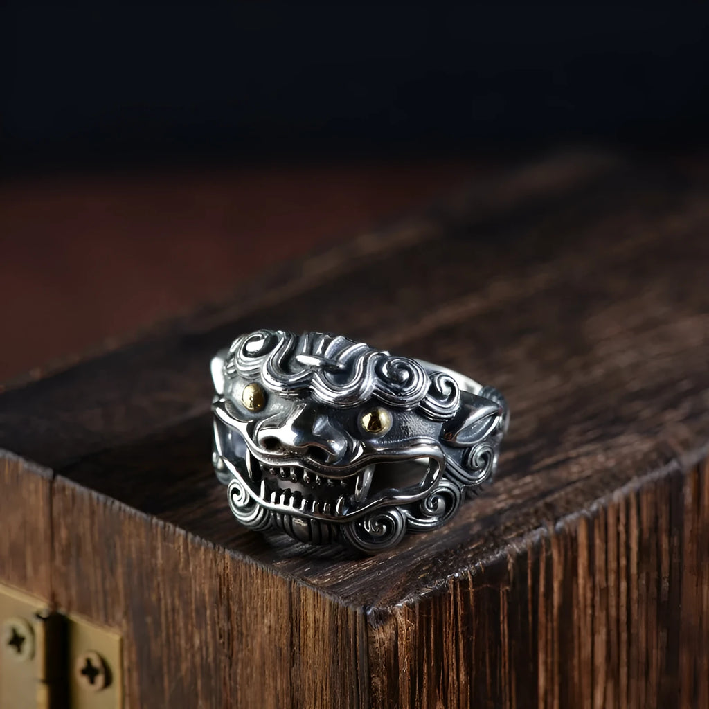 Silver open ring with a personalised diamond jibeast animal zodiac pattern on a hand.