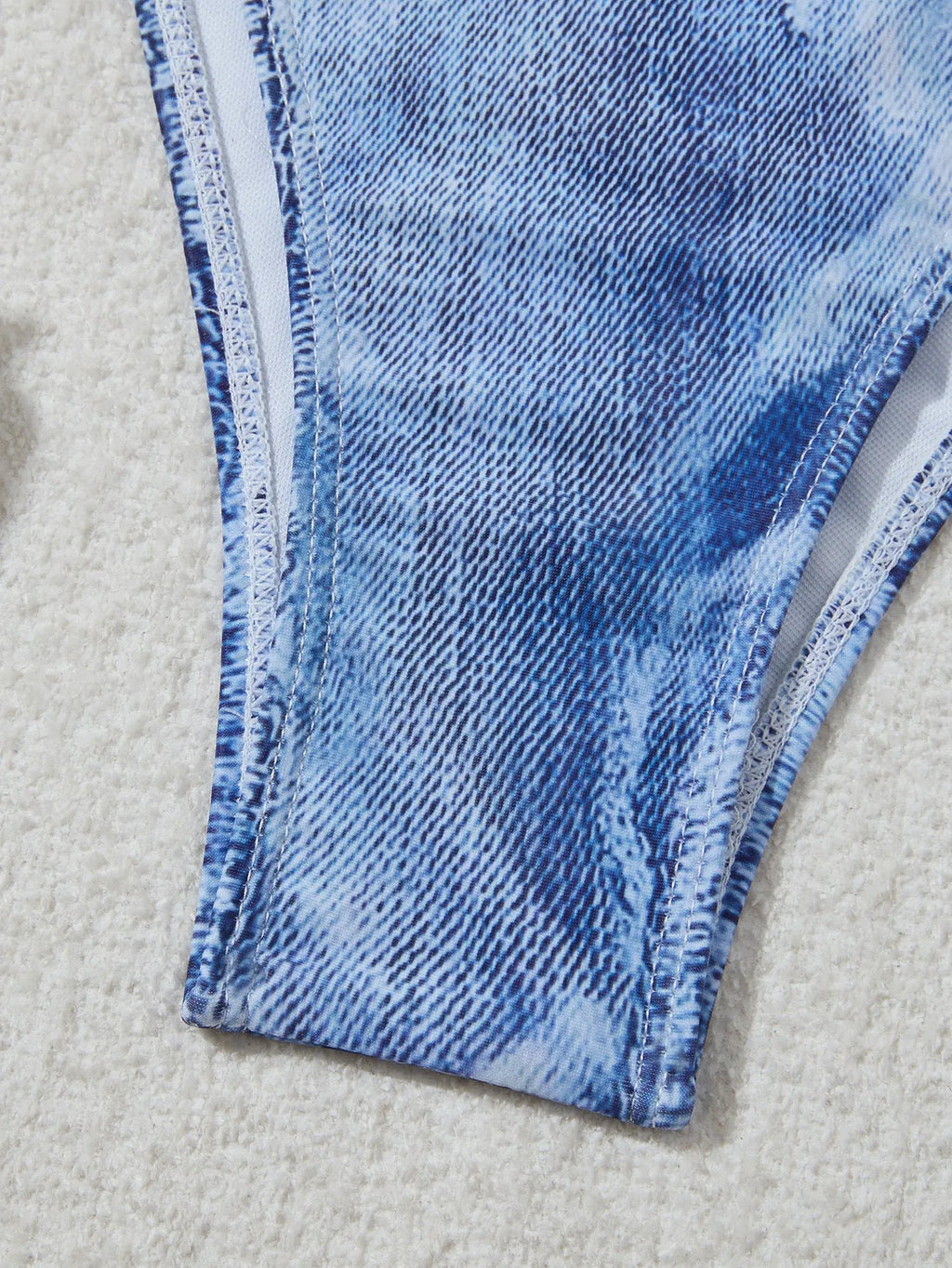 Women's denim blue strappy bikini set with printed design and two-piece swimwear construction