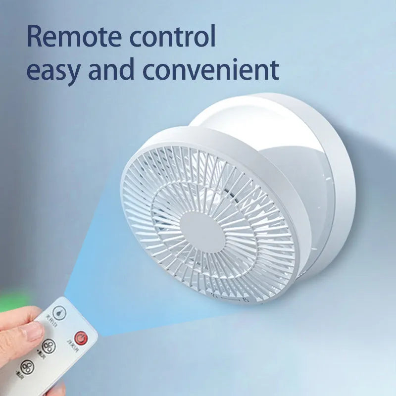 White rechargeable folding USB ceiling fan with remote control on wooden desk