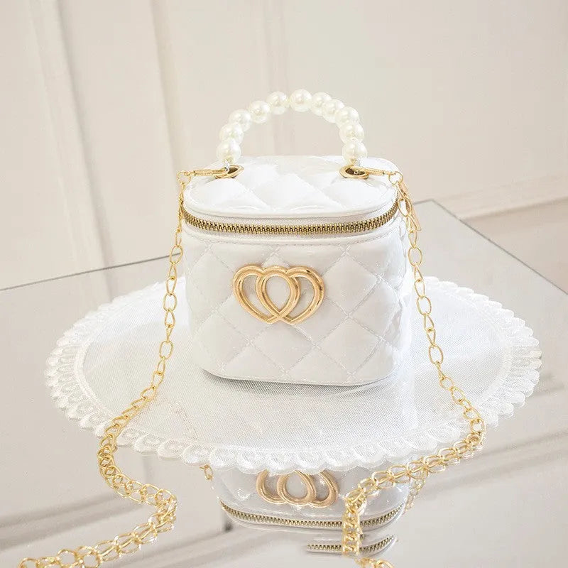 Women's PVC bucket shoulder bag with heart pattern in assorted colours