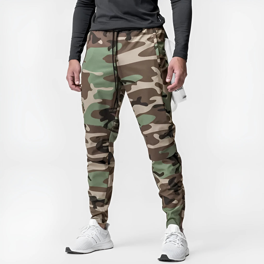 Men's grey loose-fit fitness trousers with ankle ties and quick-drying polyester fabric