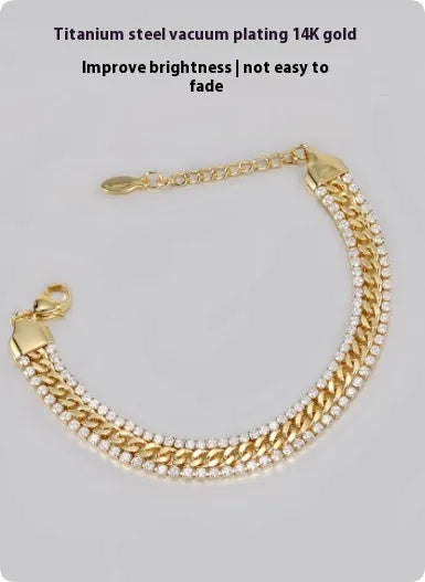 Gold colour tennis bracelet with artificial gemstone inlay on titanium steel band