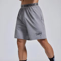 Men's loose fit sports shorts with elastic fly opening and letter details