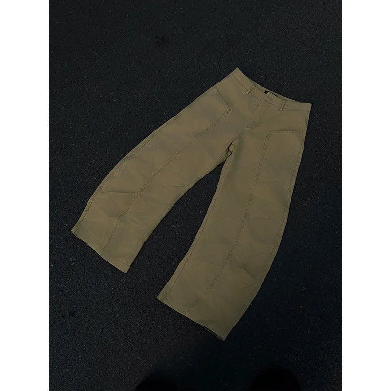 Men's khaki straight-leg cotton trousers laid flat, showing casual American retro style.