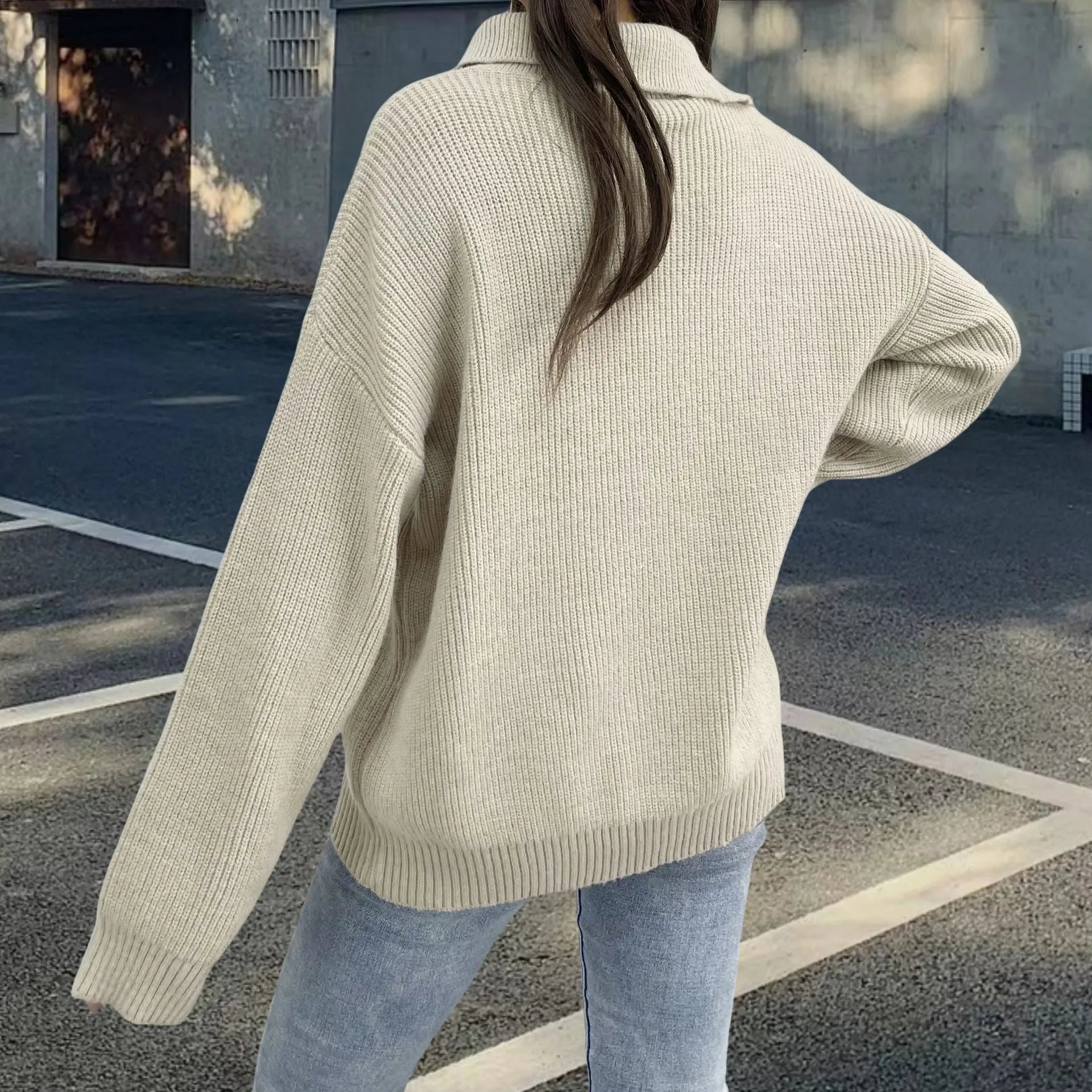 Women's light khaki alpaca wool pullover with loose lapels, turtleneck, and a diagonal front zipper.