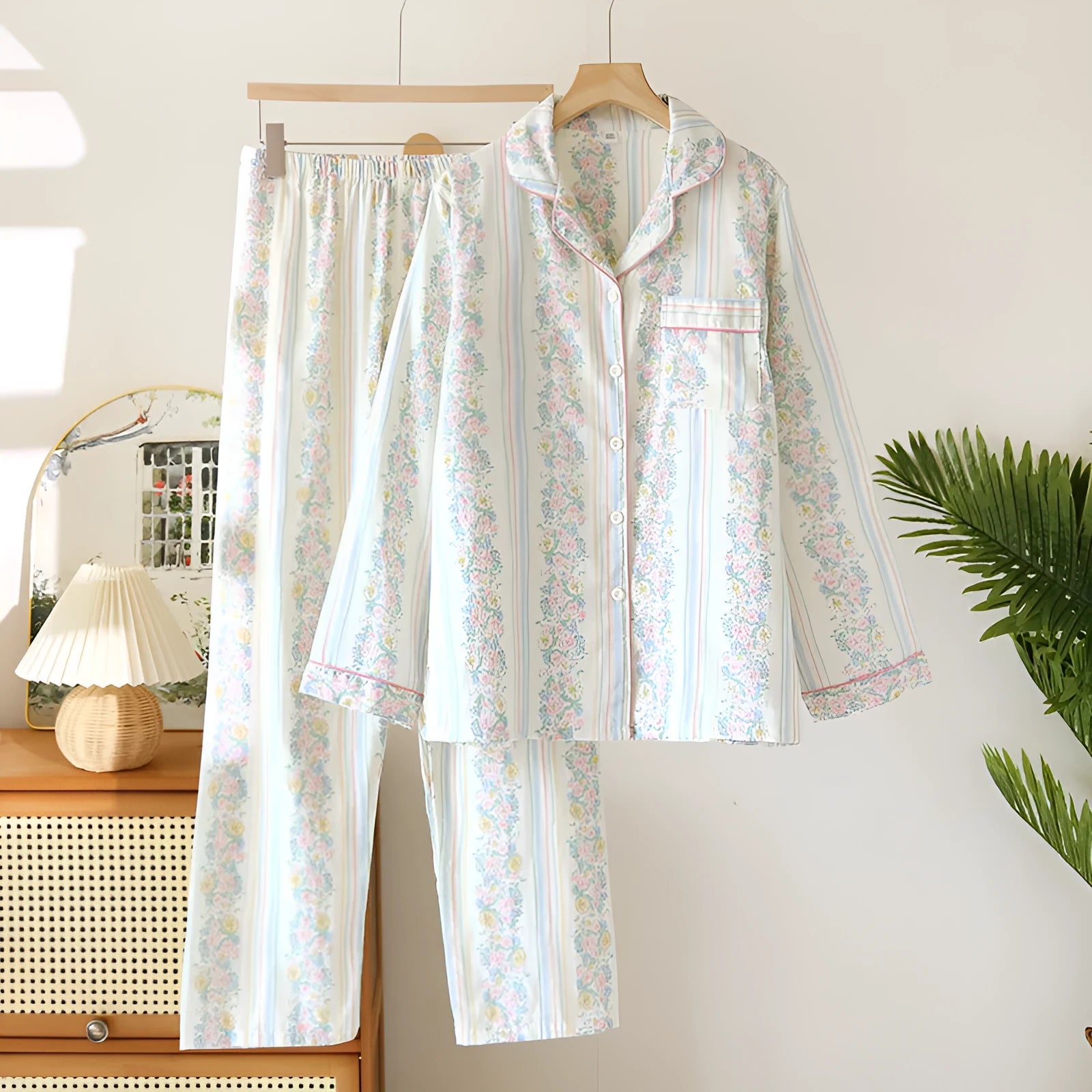 Women's cotton gauze pyjama set with long sleeves and trousers in a colour stripes or fruit print pattern.