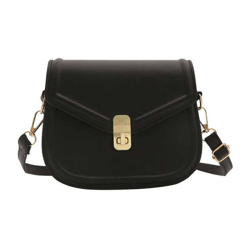 Soft PU leather messenger bag with clamshell opening in a horizontal square shape.